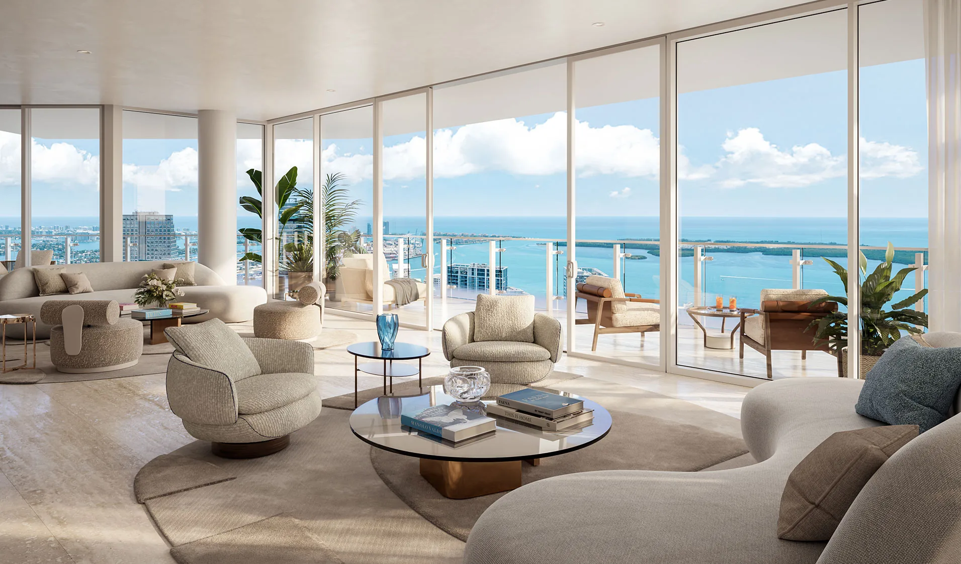 Salón de un ático de lujo con ventanales corridos y vistas al mar
